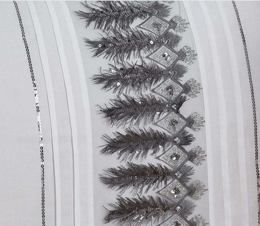 These stunning Feathers duvet covers have been beautifully made from a crisp white fabric embellished with a unique feather and silver sequin sparkle applique design across the duvet and down each pillowcase, the perfect addition to any boudoir bedroom