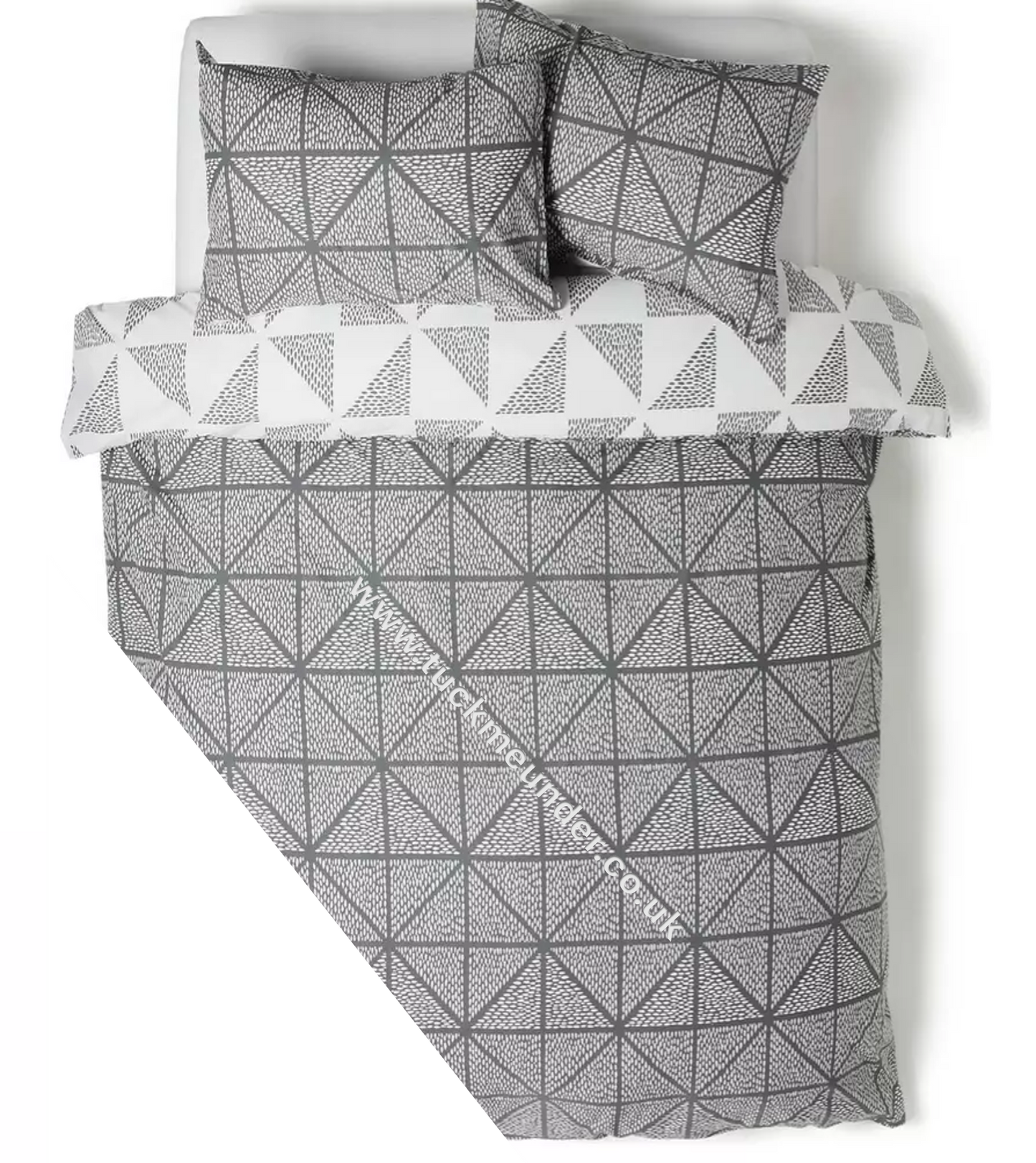 Geometric patterned french bed bedding set with a folded duvet and pillows on a white background