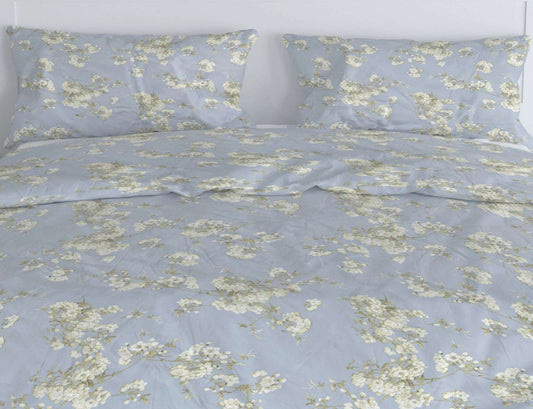 Orchard is a simple and very pretty design made up of delicate floral sprigs loosely scattered on a soft duck egg background.