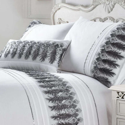 These stunning Feathers duvet covers have been beautifully made from a crisp white fabric embellished with a unique feather and silver sequin sparkle applique design across the duvet and down each pillowcase, the perfect addition to any boudoir bedroom