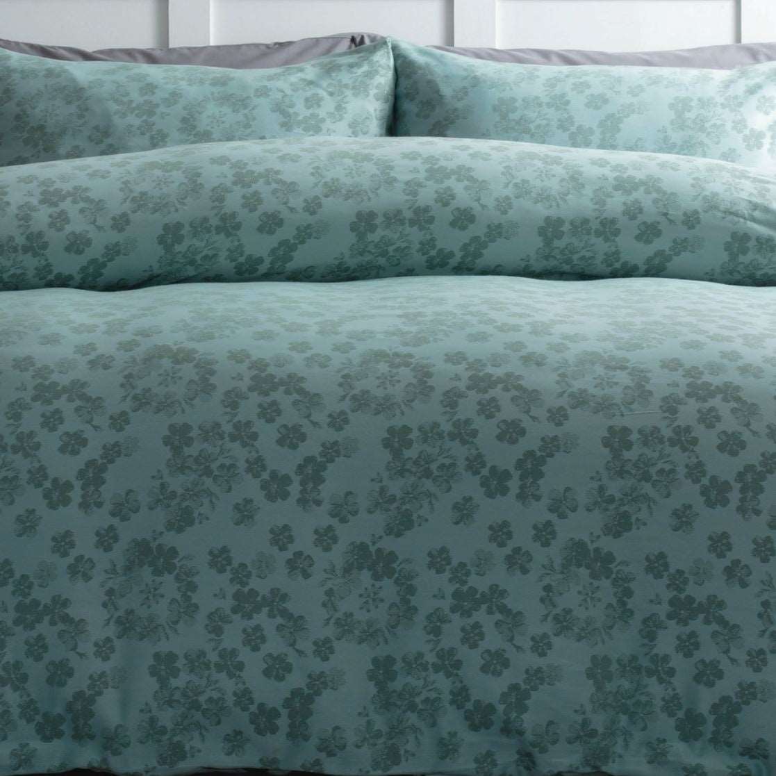 Belledorm Flora is a modern floral jacquard in a warm shade of duck egg green. The beauty of the design is in the simplicity of the pretty scattered petals.
