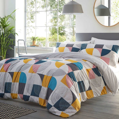The geometric Ari duvet set contains contemporary ops of colour, from navy to ochre, and rose to teal. Printed with patterned curvy shapes and fine line swirls.