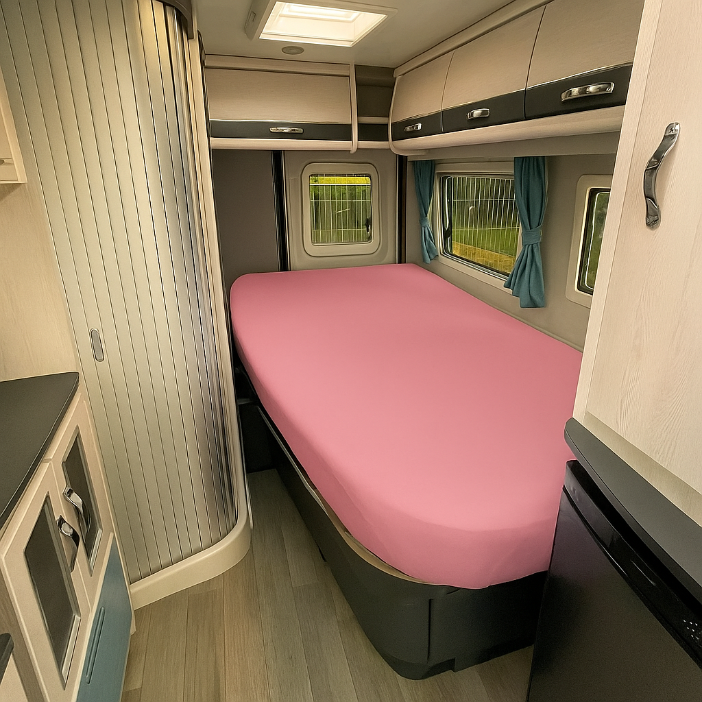 Compact living space with a pink mattress in a small room.
