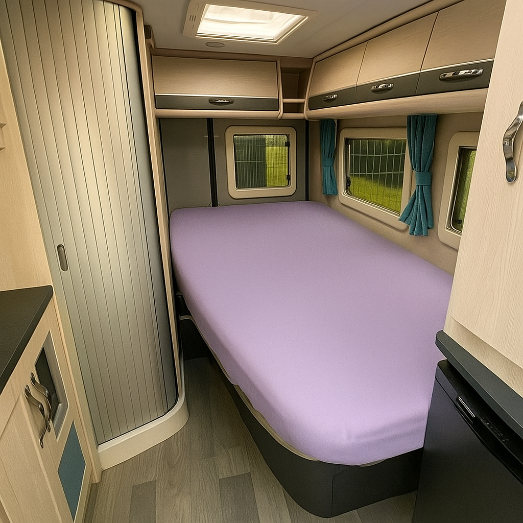 Compact bedroom interior with a bed, cabinets, and windows in a small living space.