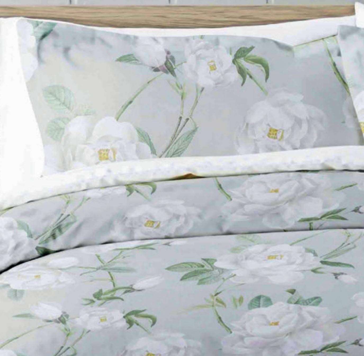 Mishka by Belledorm pillowcases Large scale white peonies ,delicate greenery and a soft grey background gives Mishka a truly pretty and contemporary feel.