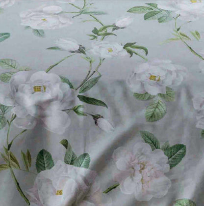 close up of Large scale white peonies ,delicate greenery and a soft grey background Mishka by Belledorm
