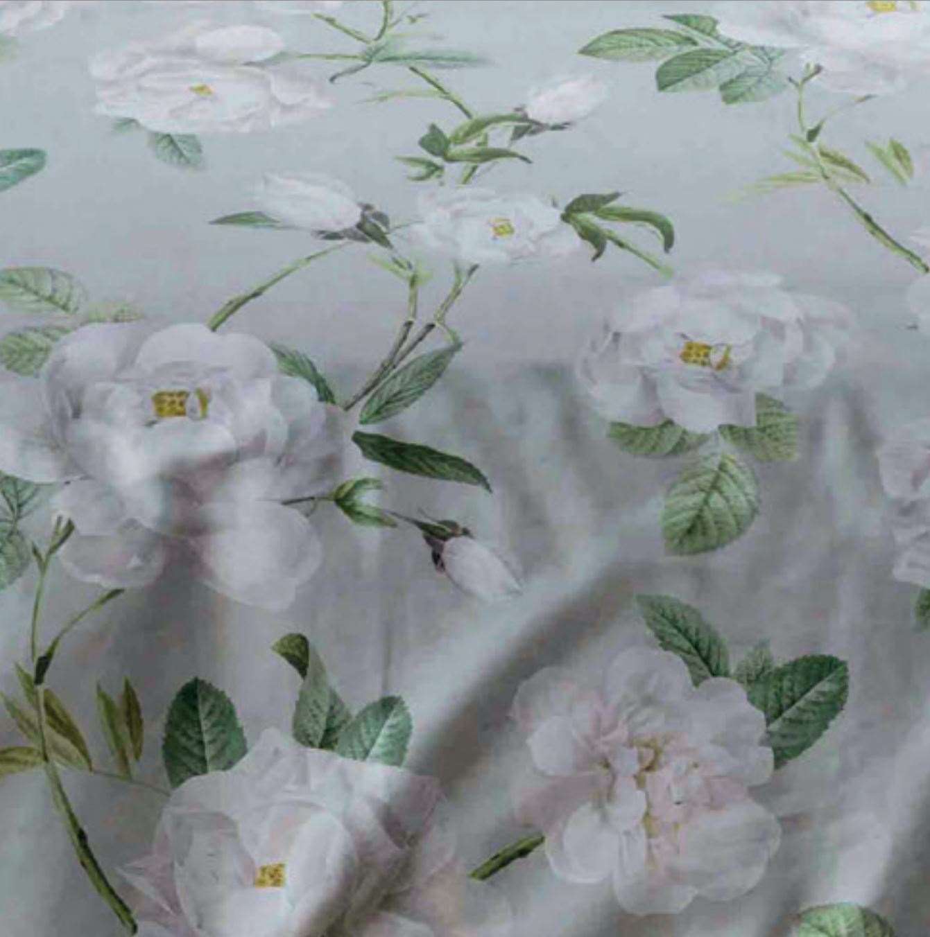Large scale white peonies ,delicate greenery and a soft grey background gives Mishka a truly pretty and contemporary feel.