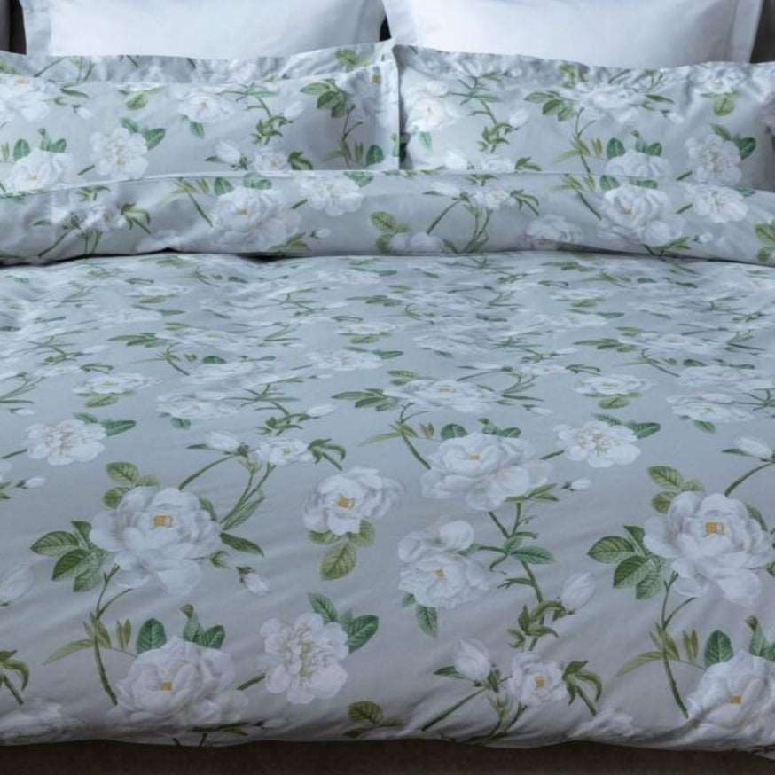 Mishka by Belledorm Large scale white peonies ,delicate greenery and a soft grey background gives Mishka a truly pretty and contemporary feel.