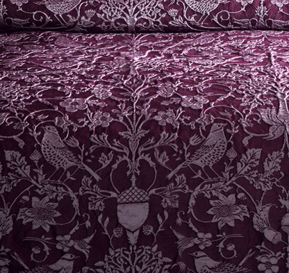 high quality woven relief jacquard in a deep plum colour palette this bedding set 