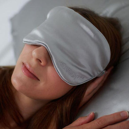 Cocoonzzz eyemask on a lady lying in bed