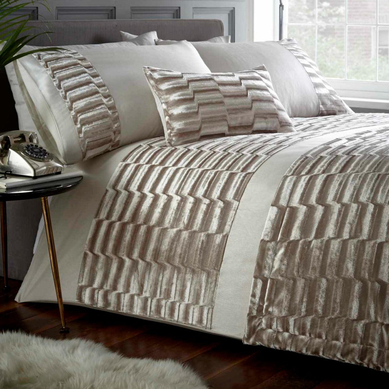 oyster cream fabric highlighted by a plush velvet band across the duvet and down each pillowcase