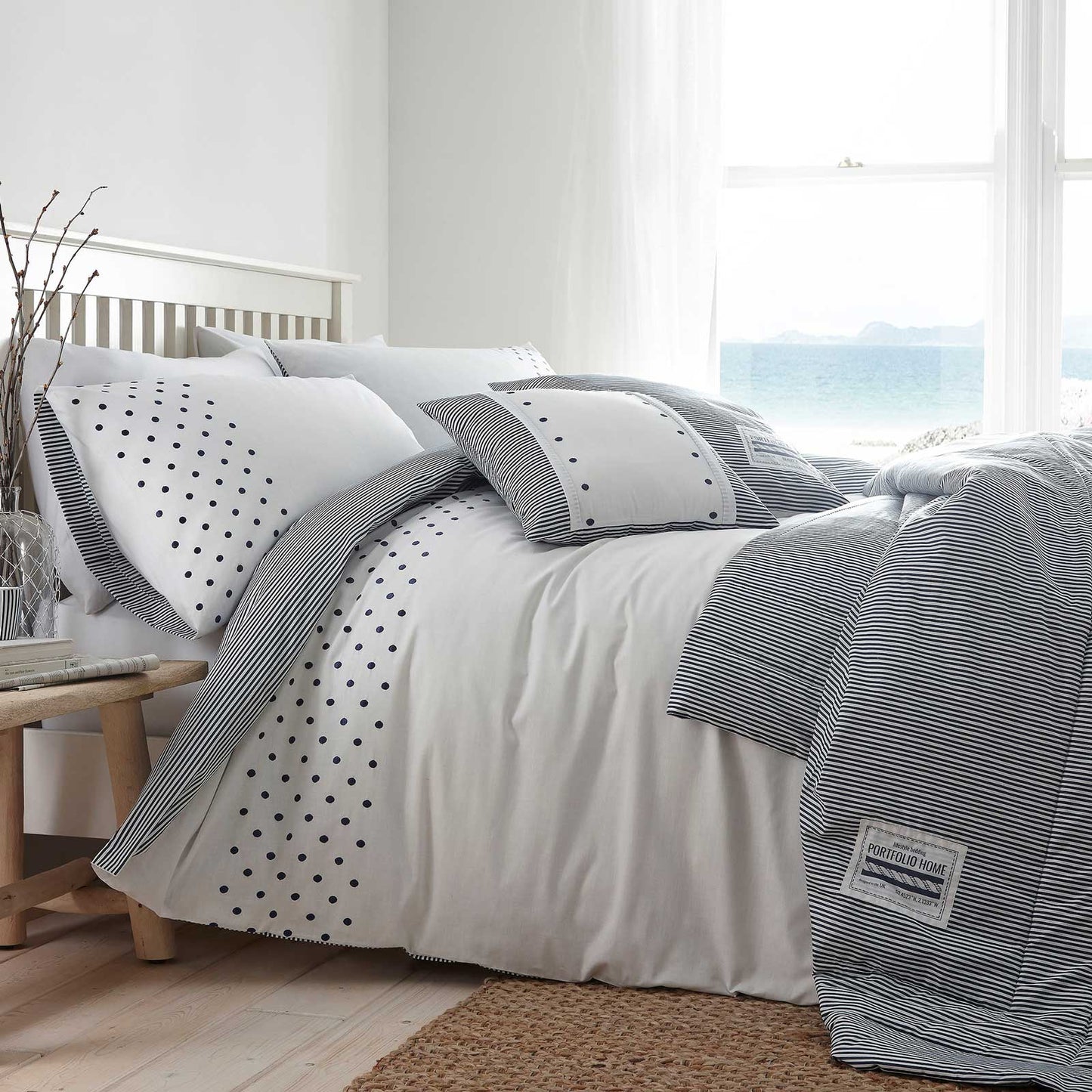 The New England bedding range features a lovely crisp white duvet cover with nautical navy tones of spots and stripe