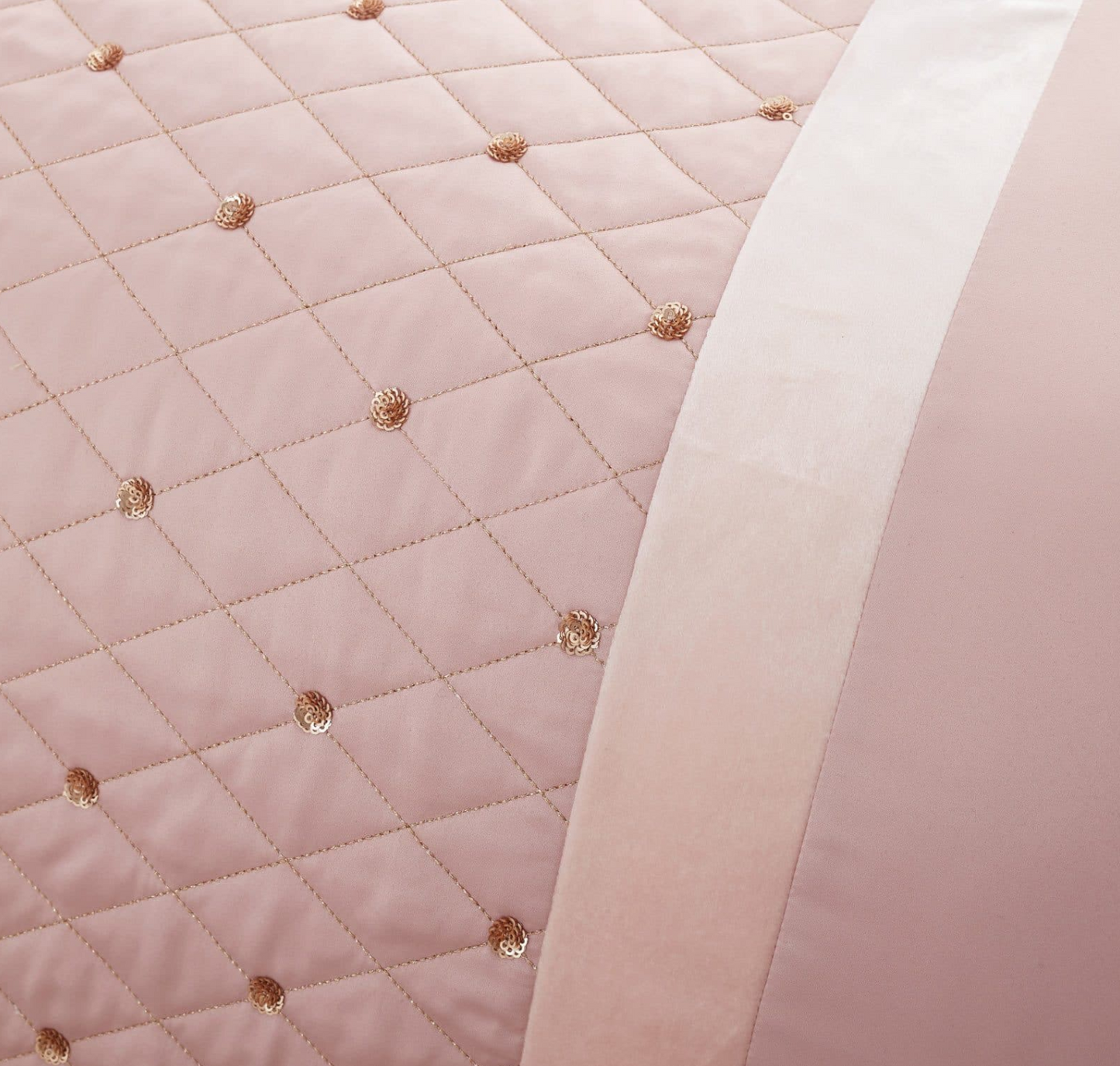 Quilted border with sequin embellishment creates an elegant look