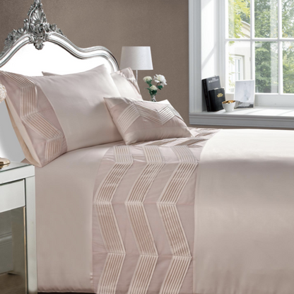 These elegant Valencia duvet covers have been beautifully made from a blush pink satin style fabric featuring a chevron pleating band across the duvet and down each pillowcase, the perfect addition to any boudoir bedroom. To complete the look, Valencia has a co-ordinating boudoir filled cushion.